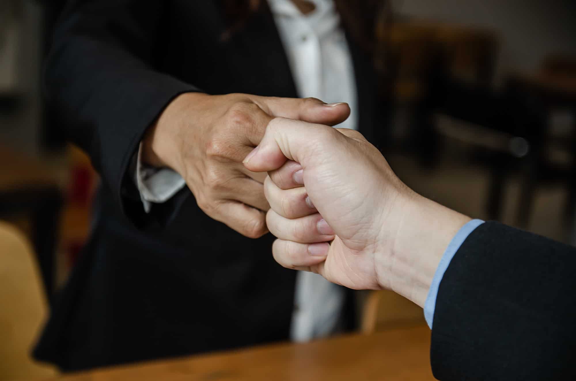 Partner Business Trust Teamwork Partnership for success.Business man fist bump hand together