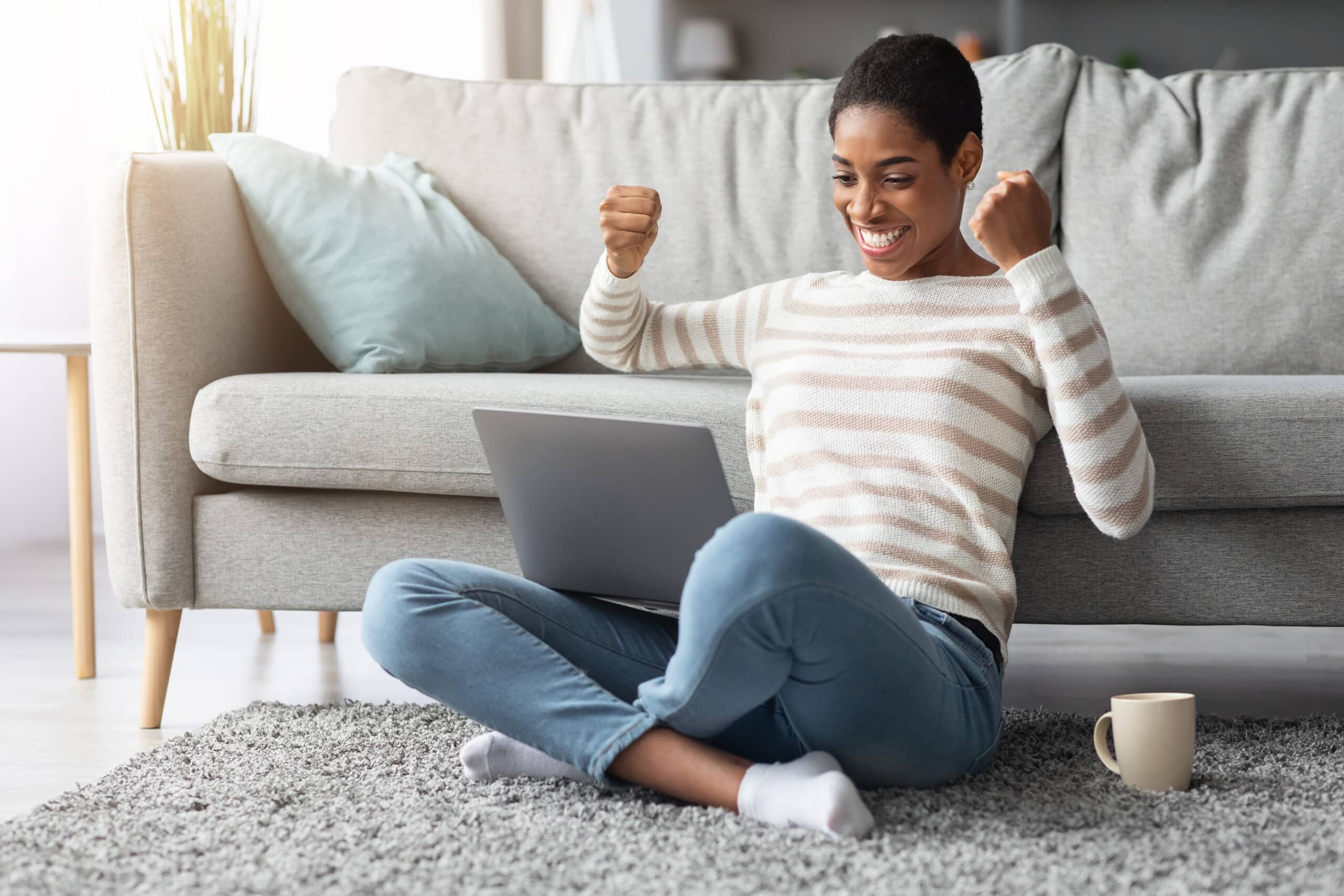 Online Profit. Joyful Happy African-American Woman Celebrating Success With Laptop At Home