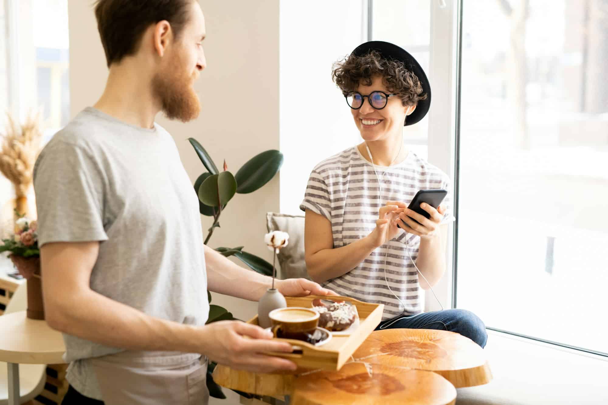 Lady customer smiling at waiter