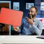 Man holds sponsorship copy space sign