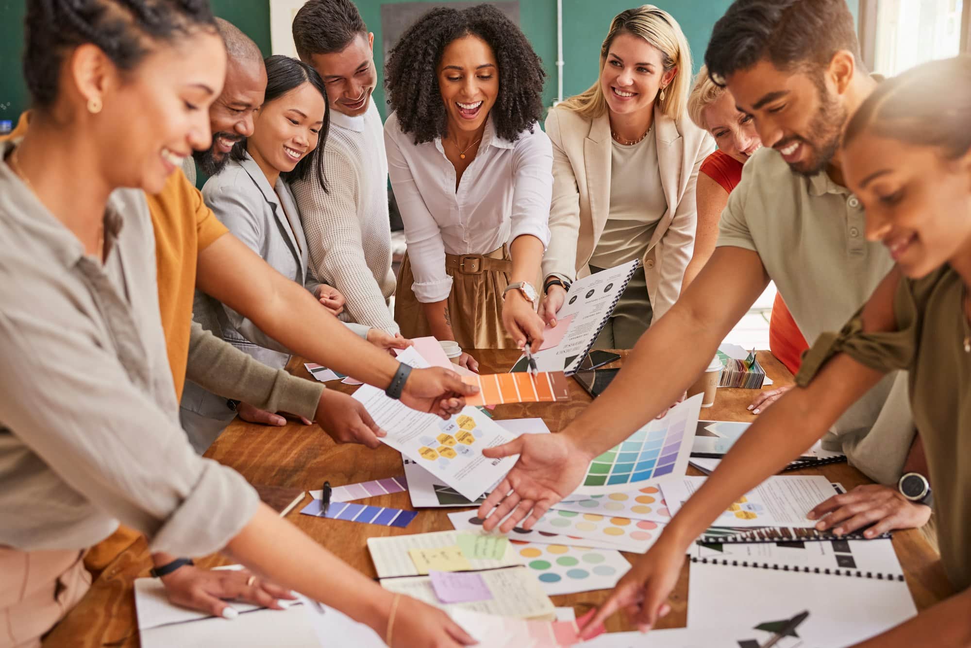 Color, creative palette and business people in meeting on desk for branding logo, strategy and mark